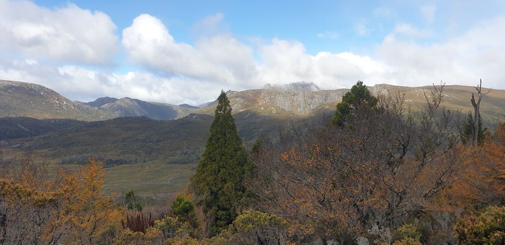 Cradle Mountain is partially revealed from cloud cover Cradle Mountain is partially revealed from cloud cover