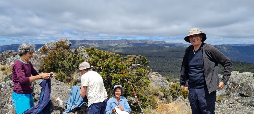 The gang settling in for a pit stop on top of Mother Cummings Peak, with Mt Ironstone and the plateau behind us. The gang settling in for a pit stop on top of Mother Cummings Peak, with Mt Ironstone and the plateau behind us.